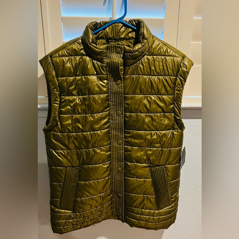 NWT green women’s vest. It’s size Small, but looks like Medium.